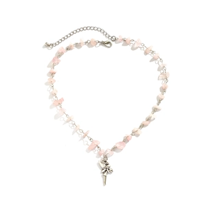 Close-up of pink crystal stone necklace with a silver fairy pendant on white background