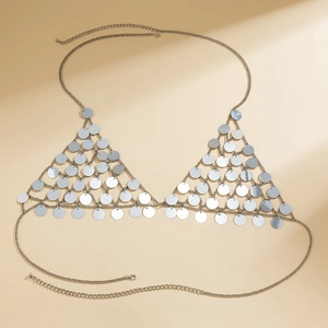 Macro detail of adjustable silver star sequin body chain bra with shiny metal fringe