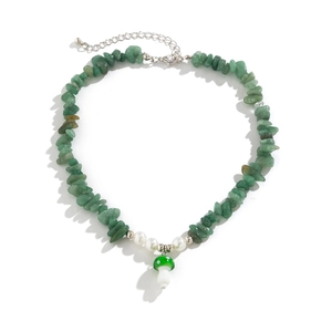 Close-up of green stone bead necklace featuring a small mushroom pendant and white pearls