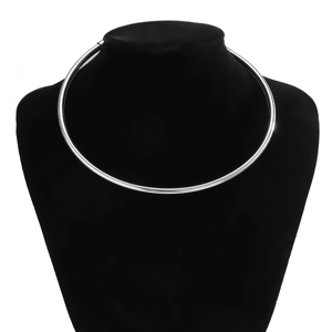 Detailed view of polished silver minimalist metal choker necklace on black neck model