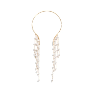 Close-up of golden metal choker with long elegant white pearl fringe details