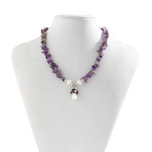 Detail of mushroom pendant necklace with purple crushed stones and white pearls