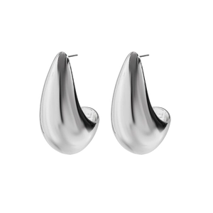 Macro detail of high-polish silver teardrop earrings with a seamless mirror finish