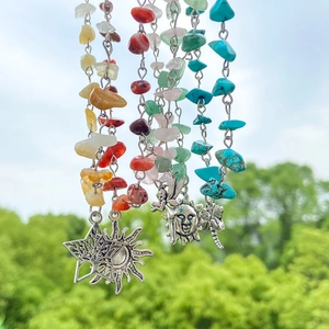 Bohemian style colorful gemstone necklace with silver pendants and mushroom sun charms