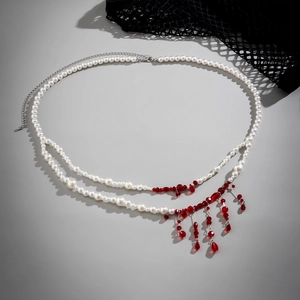 Detail of gothic waist chain with white pearls and red blood-drop fringe beads