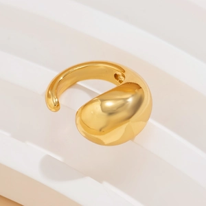 Detailed view of chunky gold teardrop ring with high-polished dome and adjustable band