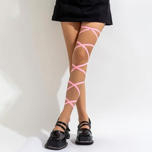 Detailed view of pink criss-cross elastic leg chain on thigh for fashion styling