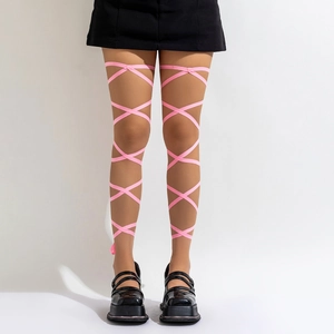 Detail of pink satin criss-cross leg straps paired with black Mary Jane platform shoes