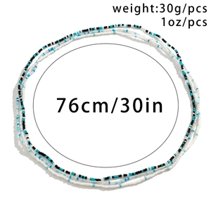 Detailweergave van blauw-zwarte kralen buikketting met maatvoering 76cm 30 inch lengte
