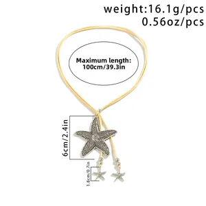 Detail view of large textured starfish pendant on a long yellow suede cord necklace