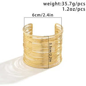 Detailed close-up of wide multi-layer wire wrapped golden open cuff bracelet with dimensions