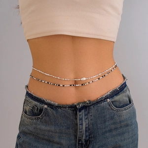 Bohemian double-layer waist chain featuring white beads and a natural seashell pendant