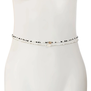 Detail of double-layer beaded waist chain with small shells and silver beads on white model