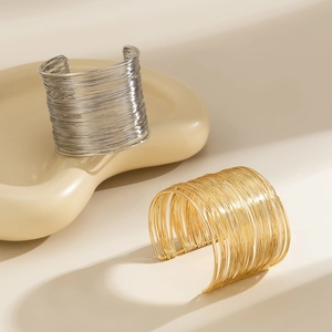 Modern gold and silver layered multi-wire open bangles with high-shine metallic finish