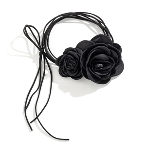 Detail of black ribbon choker featuring two handcrafted 3D fabric rose flowers