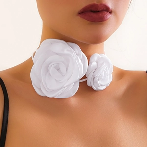 Detail of elegant white fabric rose flowers on a delicate ribbon choker necklace