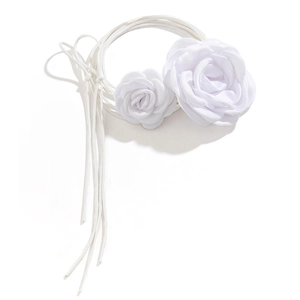 Detail of white fabric 3D rose choker with long satin ribbons for elegant styling