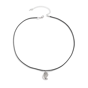 Close-up of a silver moon pendant on a black cord necklace with a lobster clasp