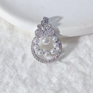Elegant gold-plated cherry pendant with sparkling zircons and white pearls on white fur