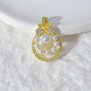 Elegant gold pendant featuring a large pearl and zircon-studded butterfly design