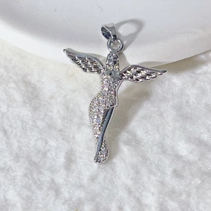 Hip hop silver angel pendant encrusted with sparkling cubic zirconia on white background