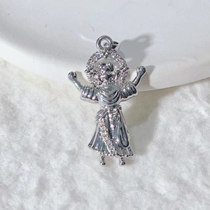 Religious silver saint pendant with sparkling cubic zirconia on white fur background