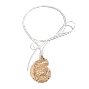 Detailed view of a golden nautilus shell pendant with a simple white cord necklace