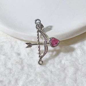 Silver bow and arrow pendant with a pink heart gemstone and sparkling micro-inlaid stones