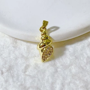 Gold conch shell pendant in 304 stainless steel with pavé set crystals on plush background