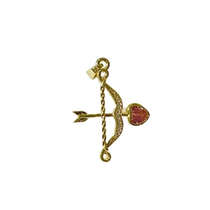 Golden Cupid's arrow pendant with sparkling crystals and a red heart-shaped gemstone