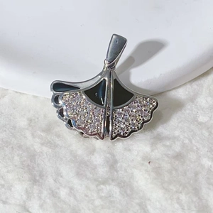 Ginkgo leaf pendant in silver metal with black enamel and white zircon inlay details
