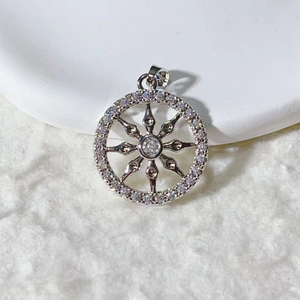 Micro shot of a sunburst pendant in silver finish featuring brilliant pavé zircons
