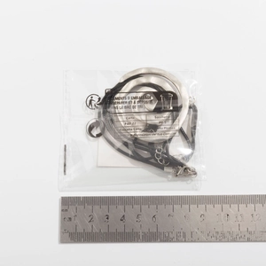 Detailed view of silver spiral pendant necklace measured with a 12cm metal ruler