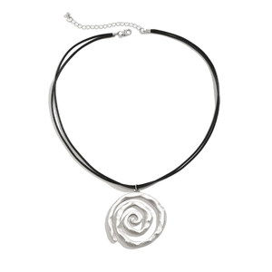 Detail of silver spiral pendant with hammered texture on a black double-cord necklace