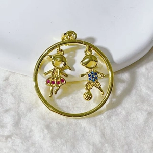 Gold circle charm with boy and girl figures in purple and blue rhinestones