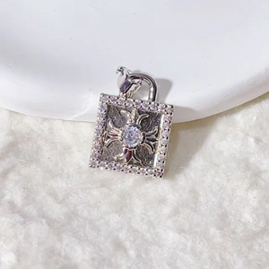 Square silver zircon pendant with cross relief design in a luxury punk jewelry style