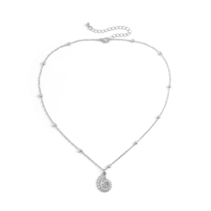 Detailed macro view of silver conch shell pendant with delicate beaded chain and lobster clasp
