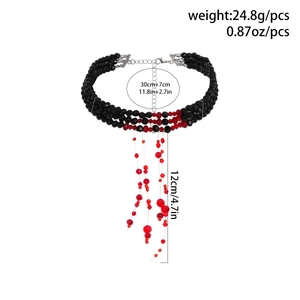Detailed view of Gothic black beaded choker with red crystal fringe and silver clasp