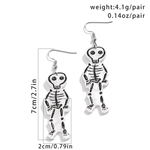Macro view of white acrylic skeleton drop earrings with size and weight measurements
