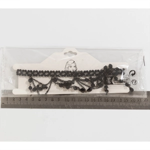 Gothic beaded choker necklace with red blood drop crystals measured with a metal ruler