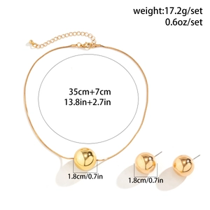 Detail showing snake bone chain necklace and ball stud earrings with precise dimensions