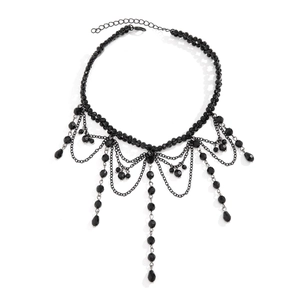 Close-up of gothic black beaded fringe necklace with layered water drop tassel details