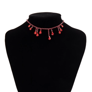 Detailed view of red crystal blood drip choker on neck mannequin for Halloween costume