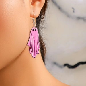 Close-up of pink acrylic ghost earrings for Halloween worn by a model in a side profile view