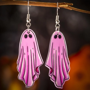 Close-up of pink acrylic ghost earrings hanging on a branch for Halloween jewelry detail