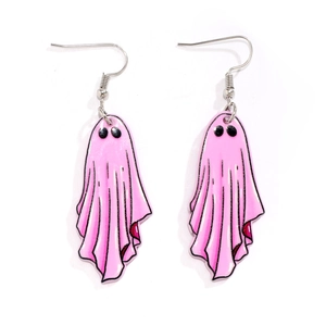 Close-up of pink acrylic ghost earrings with black eyes and silver metal ear hooks