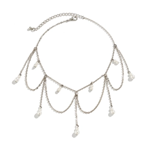 Detail of layered silver chain choker featuring bohemian fringe and white pearls