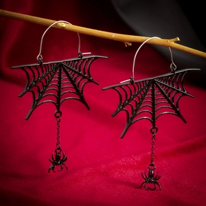 Gothic black spider web earrings with tassel drops on red velvet background
