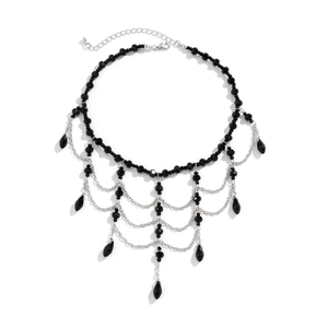 Gothic beaded choker detail with black layered tassels and red blood drop style crystals