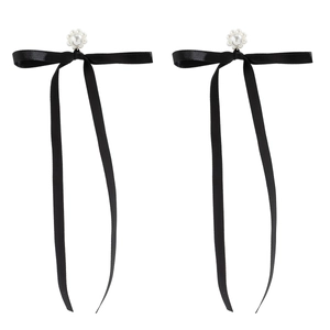 Detail of black satin bow earrings featuring elegant imitation pearl flower clusters
